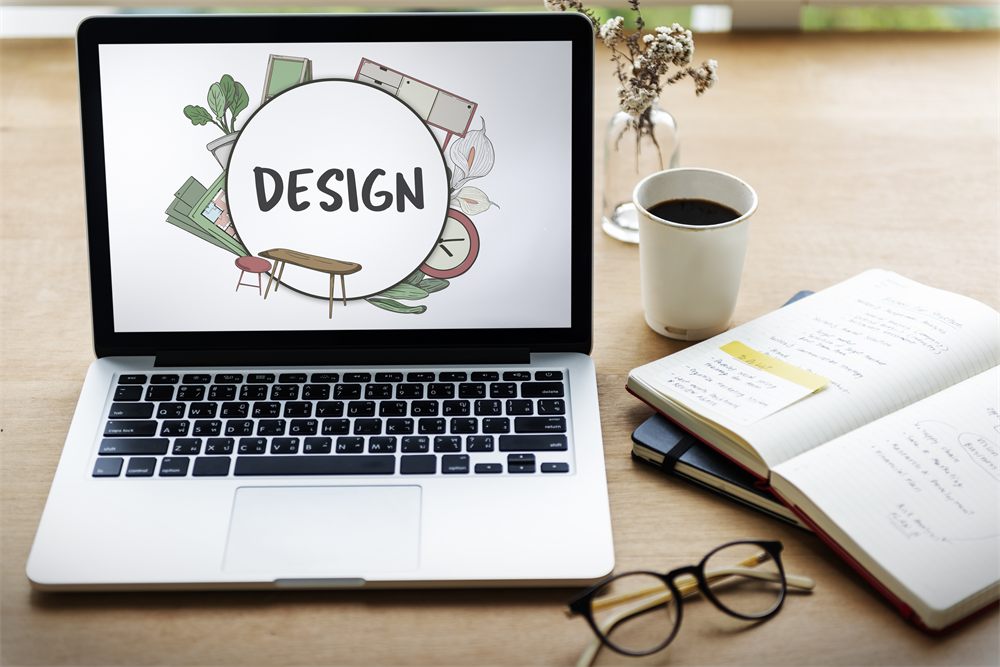 Design concept displayed on a laptop in a creative workspace
