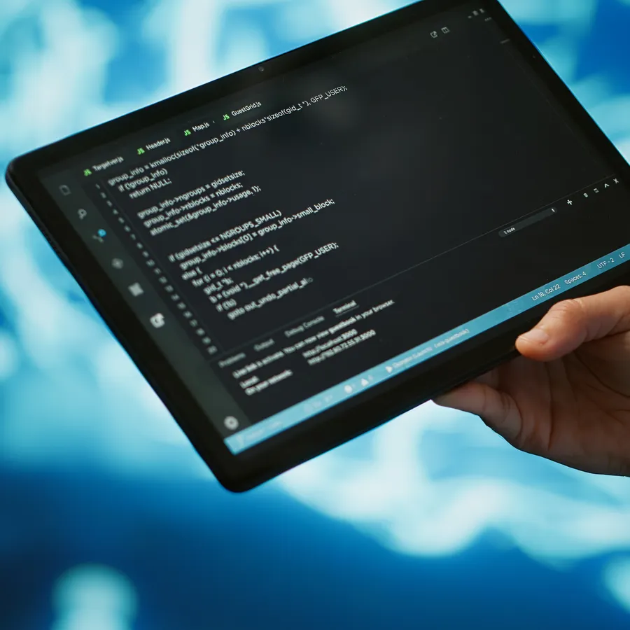 Professional working with AI algorithms on a tablet